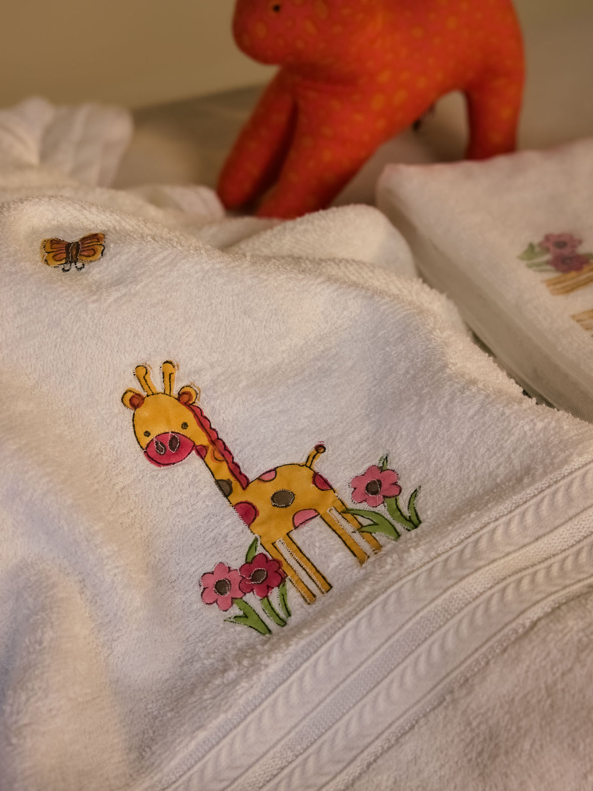 Giraffe With Flowers Baby Towel